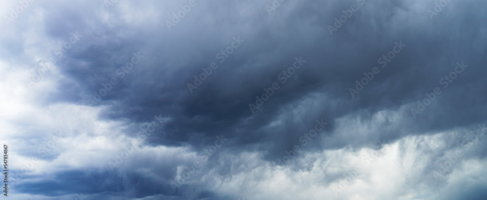 Dramatic storm clouds background. Dark ominous weather banner.