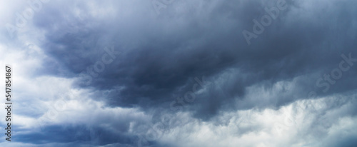 Dramatic storm clouds background. Dark ominous weather banner.