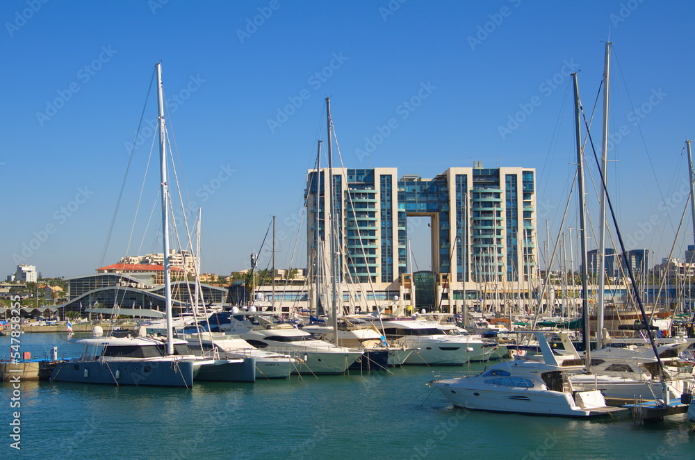 Yacht Marina Herzliya Israel. Pier where sailing boats are moored. Traveling on a sailboat, sea holidays, rent and charter of yachts.