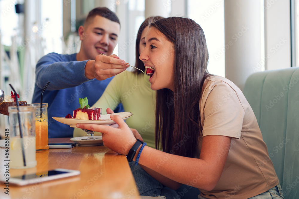 Young people having fun together at cafeteria on brunch time Young people having fun together at cafeteria on brunch time