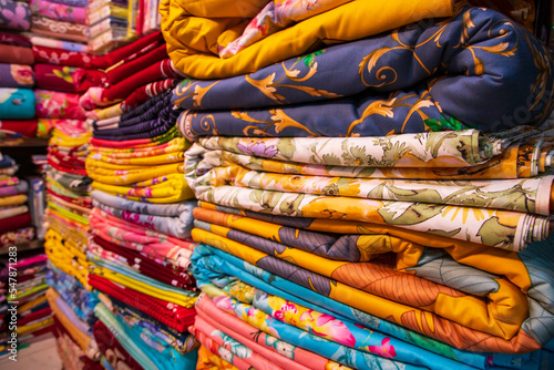 Wallpaper Mural Artistic variety shade tone colors Bed sheets stacked on retail Shop Shelf to sale Torontodigital.ca