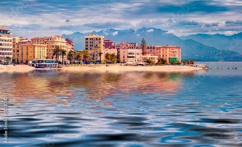 Ajaccio town reflected in the calm waters of Mediterranean sea. Colorful morning scene of Corsica island, France, Europe. Traveling concept background.