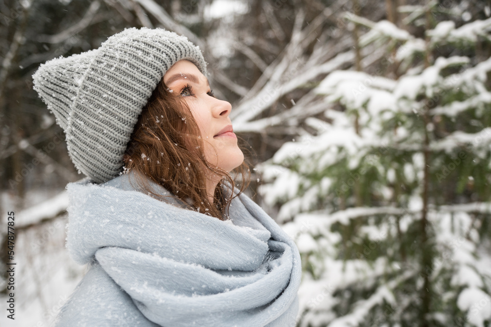 Portrait of a girl on the street under the snow
