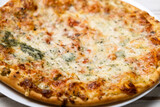 Freshly cooked pizza with blue cheese. Close-up.