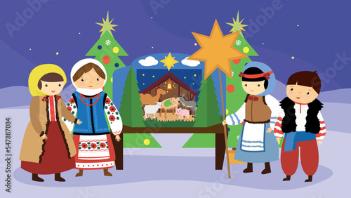 Christmas carols near the nativity scene