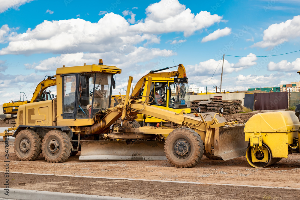 Powerful construction equipment for the construction of a new facility. Construction equipment for earthworks. Modern building site. Excavators, bulldozers, loaders, graders. Powerful construction equipment for the construction of a new facility. Construction equipment for earthworks. Modern building site. Excavators, bulldozers, loaders, graders.