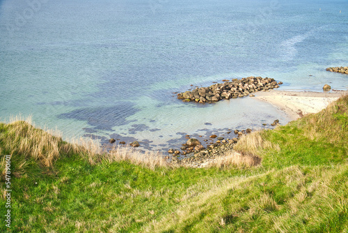 Hundested, Denmark on the cliff overlooking the sea. Baltic Sea coast, grassy photo