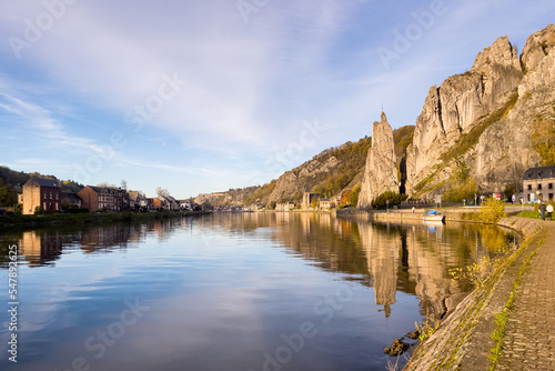 Rocher Bayard with its reflection on the Meuse river in Dinant, Belgium