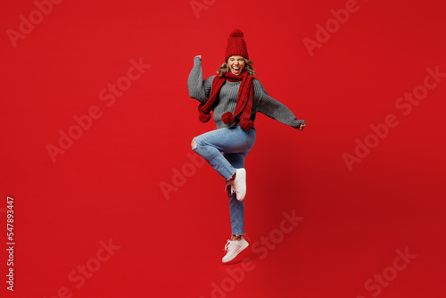 Obraz na płótnie Full body young excited woman wear grey sweater scarf hat jump high do winner ge