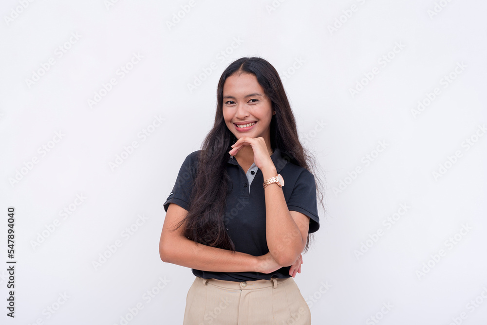 An attractive young female entrepreneur looking at the camera with her hand on her chin. A reliable and competent employee in smart casual clothes. Isolated on a white background. An attractive young female entrepreneur looking at the camera with her hand on her chin. A reliable and competent employee in smart casual clothes. Isolated on a white background.