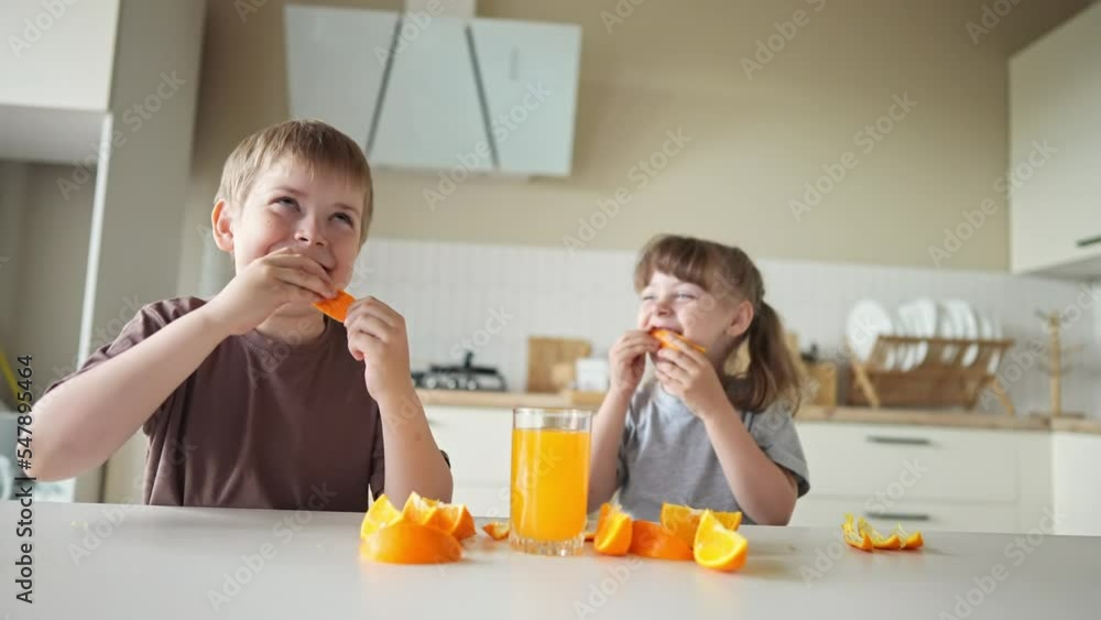 Vidéo Stock children eat oranges. happy family a kid dream concept