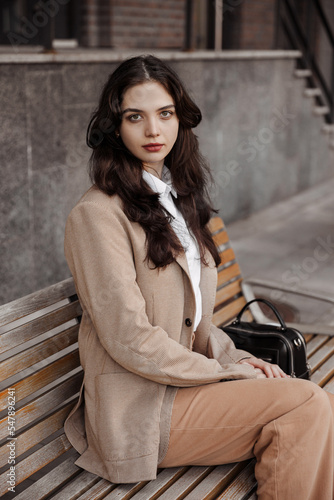 Close up portrait of young business woman of the modern office building background  photo