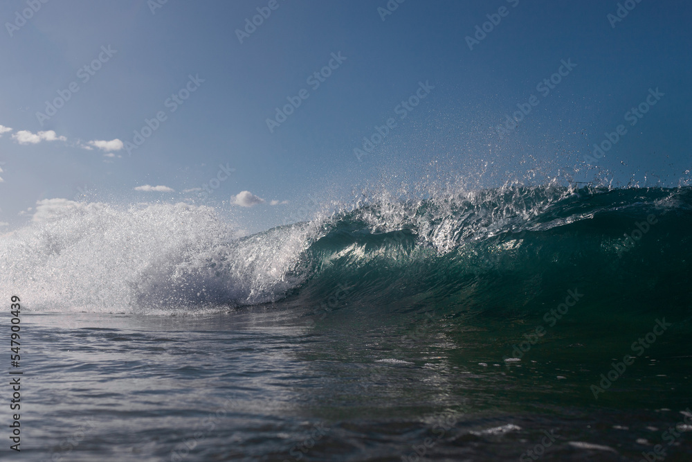 Spray of wave barrel breaking in the ocean. Spray of wave barrel breaking in the ocean.