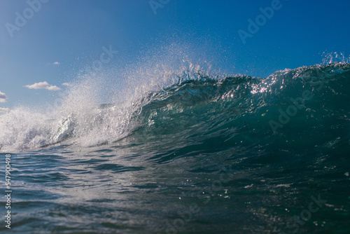 Wave barrel breaking in the ocean.