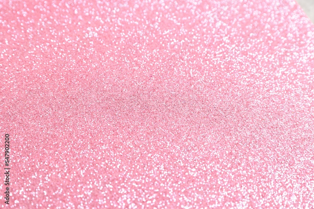 Beautiful pink shiny glitter as background, top view Beautiful pink shiny glitter as background, top view