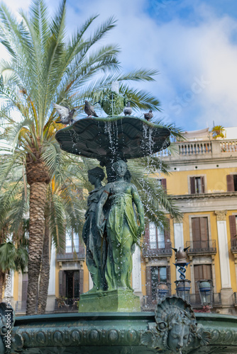 Fountain of the Plaza Real, tourist square in the center of Barcelona (Spain), travel concept. photo