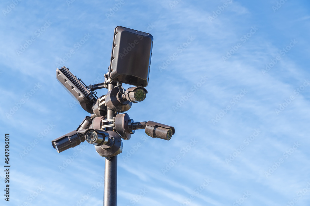 Surveillance camera and blue sky. Surveillance camera and blue sky.