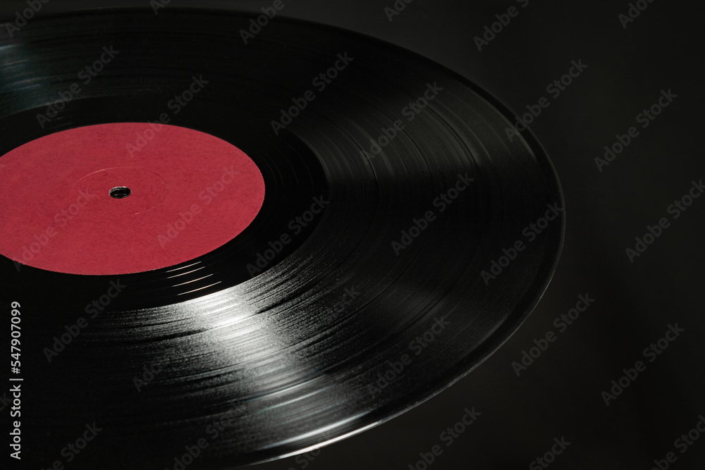 vinyl record on black background with red label vinyl record on black background with red label