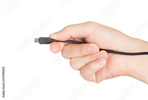 closeup hand holding electrical plug and micro usb plug