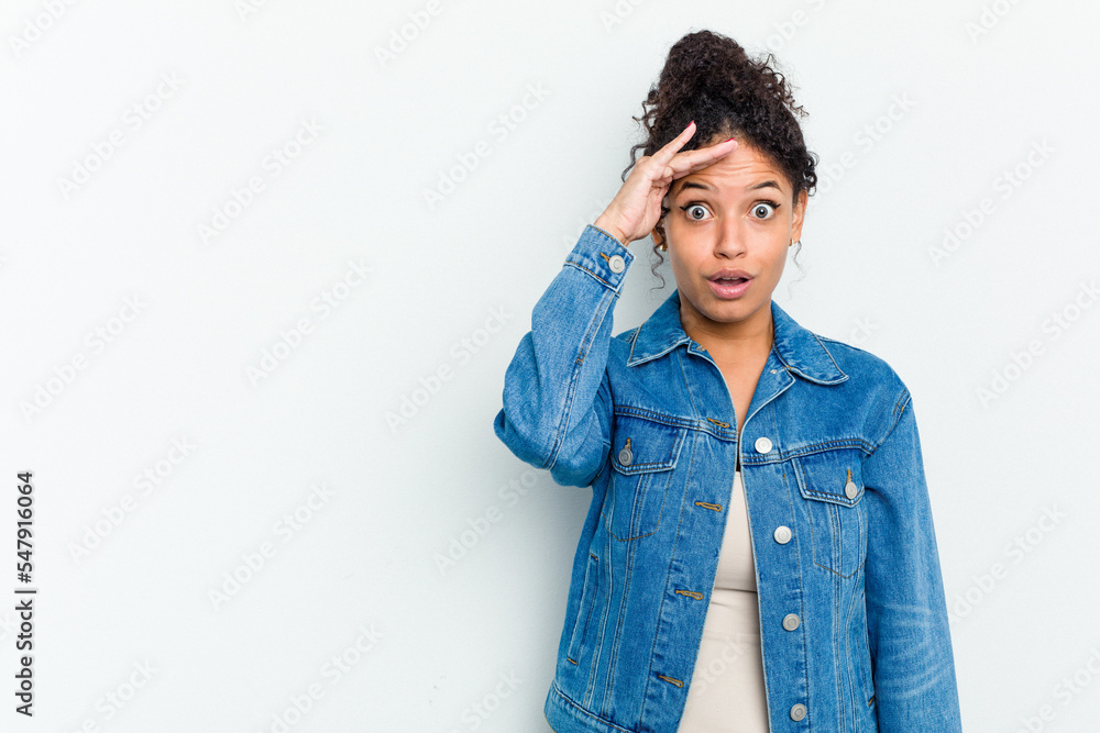 Young african american woman isolated shouts loud, keeps eyes opened and hands tense. Young african american woman isolated shouts loud, keeps eyes opened and hands tense.