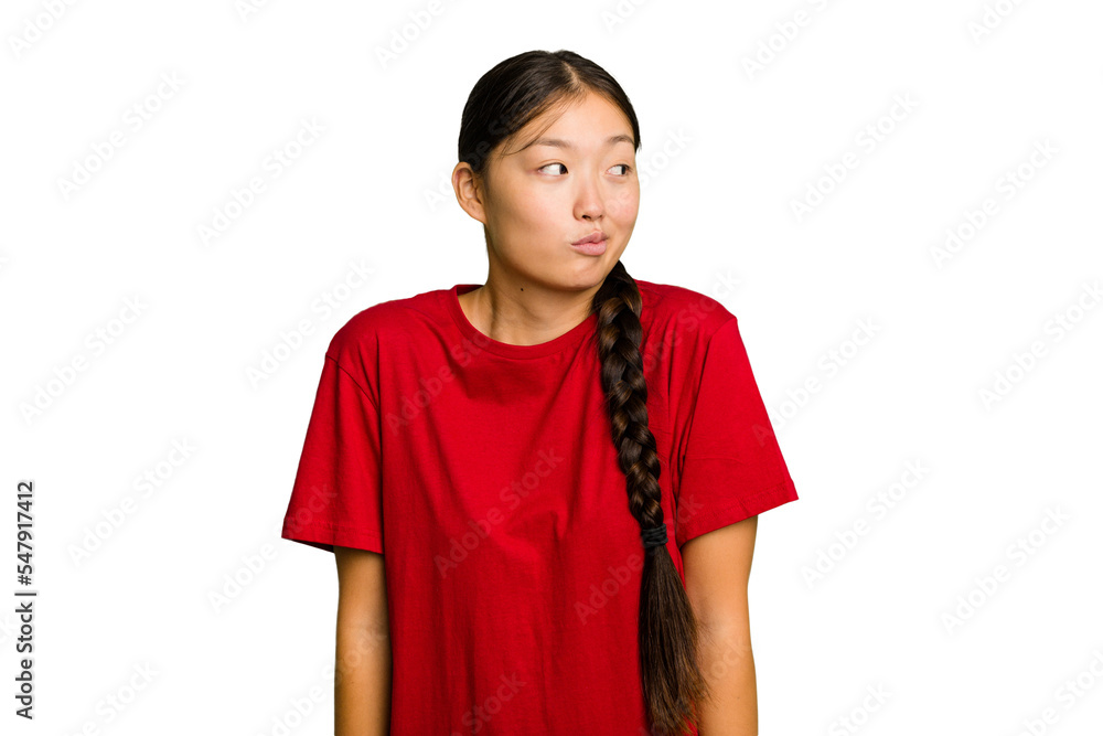 Young Asian woman isolated shrugs shoulders and open eyes confused. Young Asian woman isolated shrugs shoulders and open eyes confused.
