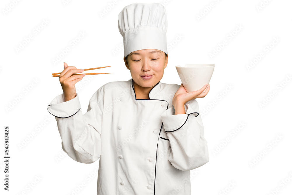 Young asian chef woman preparing noodles isolated Young asian chef woman preparing noodles isolated