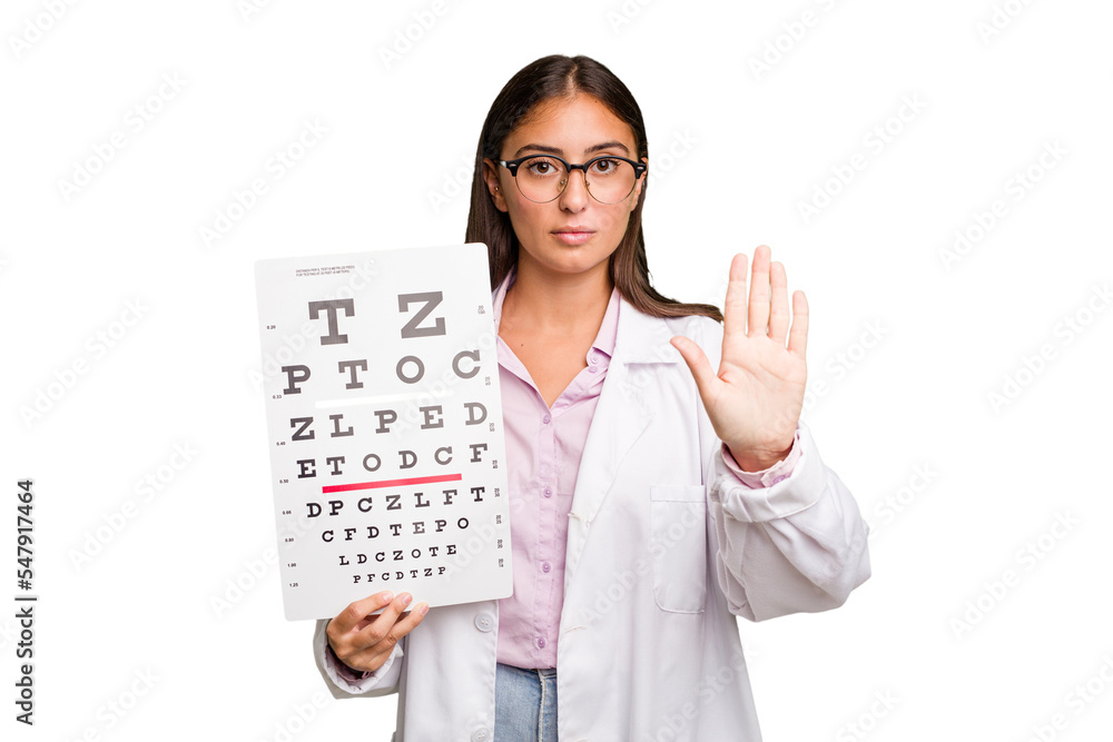 Young caucasian oculist woman isolated standing with outstretched hand showing stop sign, preventing you.