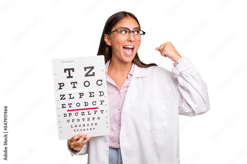 Young caucasian oculist woman isolated raising fist after a victory, winner concept. Young caucasian oculist woman isolated raising fist after a victory, winner concept.