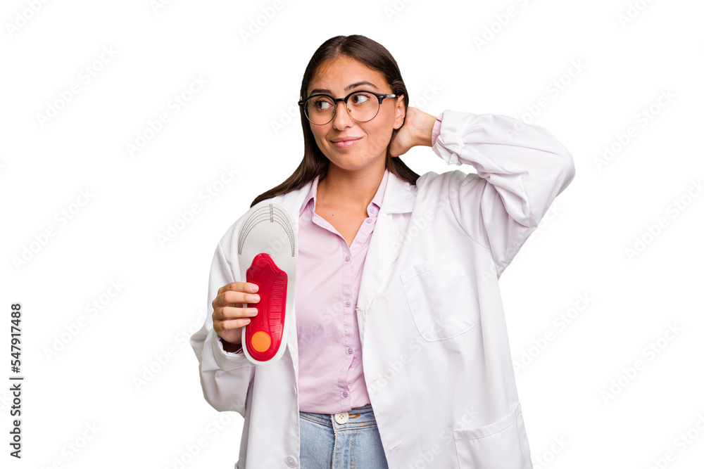 Young caucasian podiatrist woman isolated touching back of head, thinking and making a choice. Young caucasian podiatrist woman isolated touching back of head, thinking and making a choice.