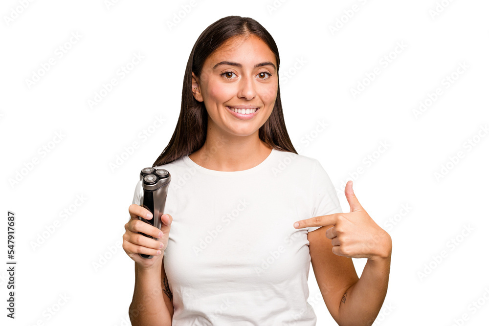 Young caucasian woman holding a razor isolated person pointing by hand to a shirt copy space, proud and confident Young caucasian woman holding a razor isolated person pointing by hand to a shirt copy space, proud and confident