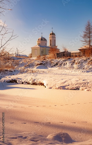 The building of the Orthodox church against the blue sky in winter. Russia. Ural. Kungurka