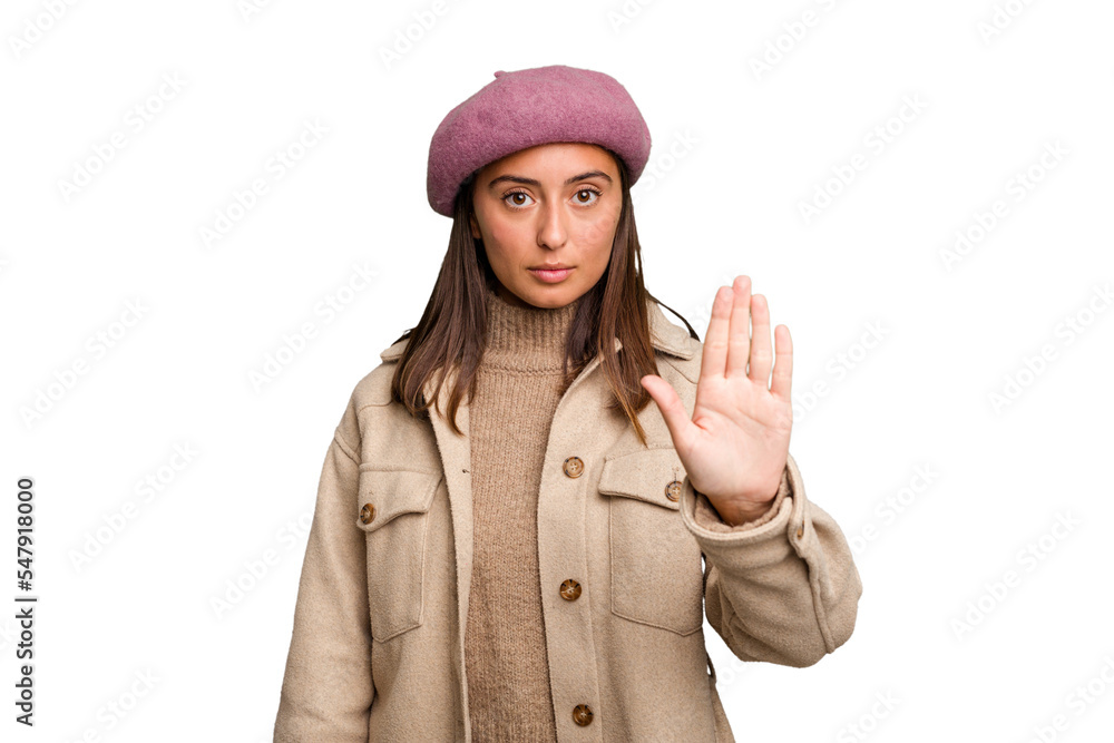 Young caucasian woman wearing winter jacket isolated standing with outstretched hand showing stop sign, preventing you. Young caucasian woman wearing winter jacket isolated standing with outstretched hand showing stop sign, preventing you.