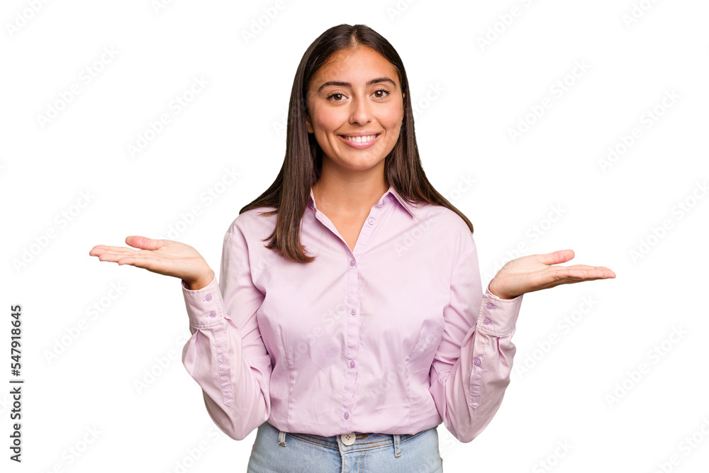 Young cute caucasian woman isolated makes scale with arms, feels happy and confident. Young cute caucasian woman isolated makes scale with arms, feels happy and confident.