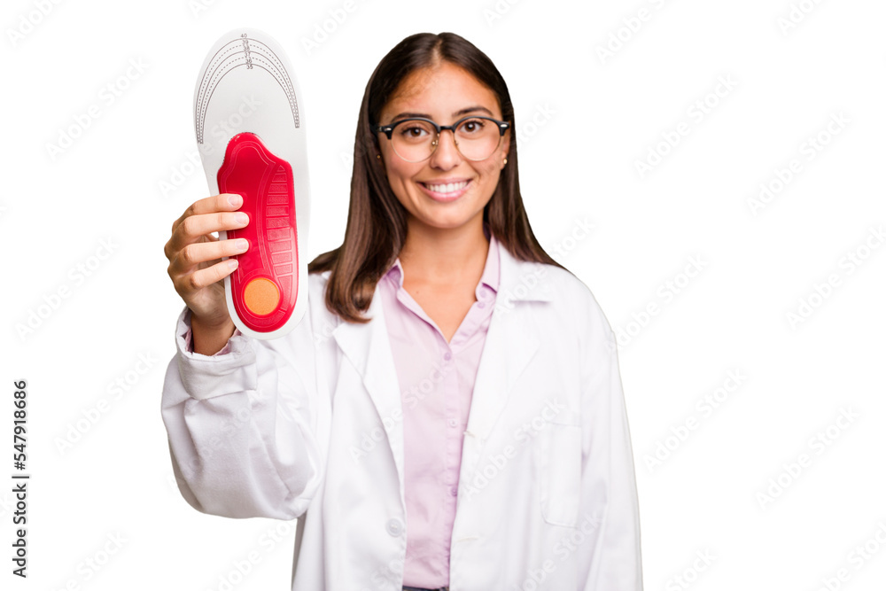Young caucasian podiatrist woman holding a template isolated Young caucasian podiatrist woman holding a template isolated