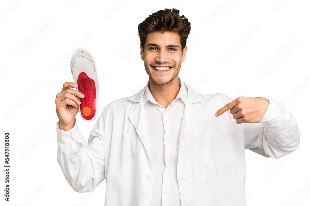 Young caucasian chiropodist man isolated person pointing by hand to a shirt copy space, proud and confident Young caucasian chiropodist man isolated person pointing by hand to a shirt copy space, proud and confident