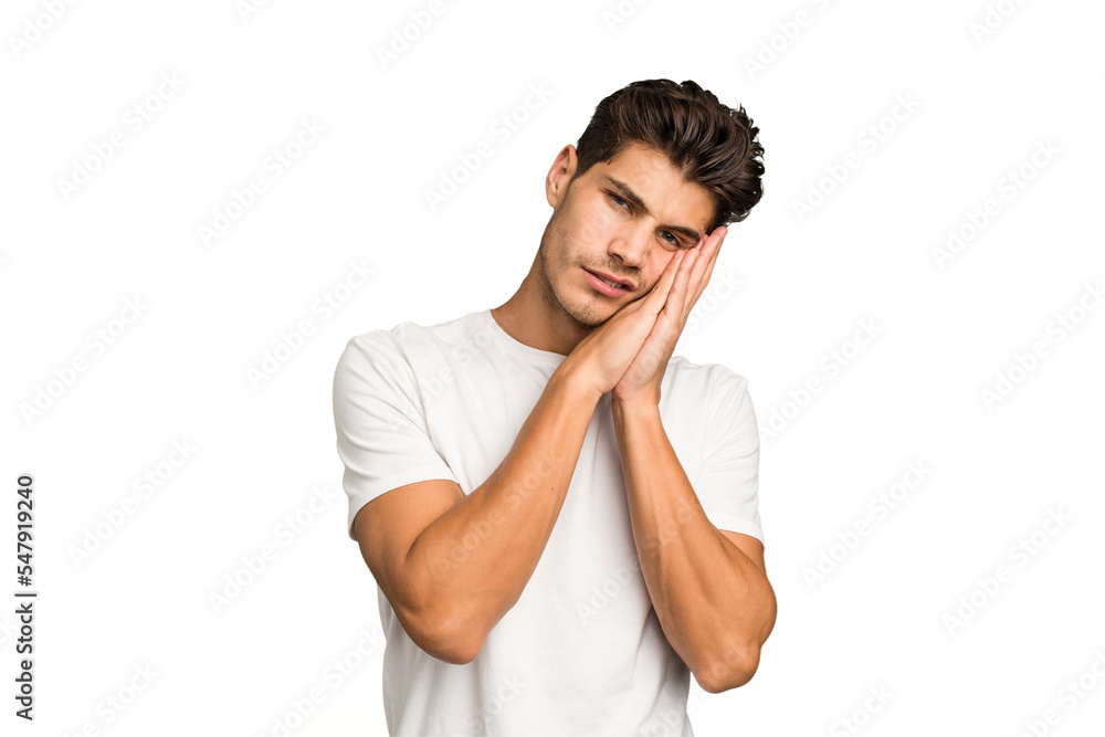 Young caucasian handsome man isolated yawning showing a tired gesture covering mouth with hand. Young caucasian handsome man isolated yawning showing a tired gesture covering mouth with hand.