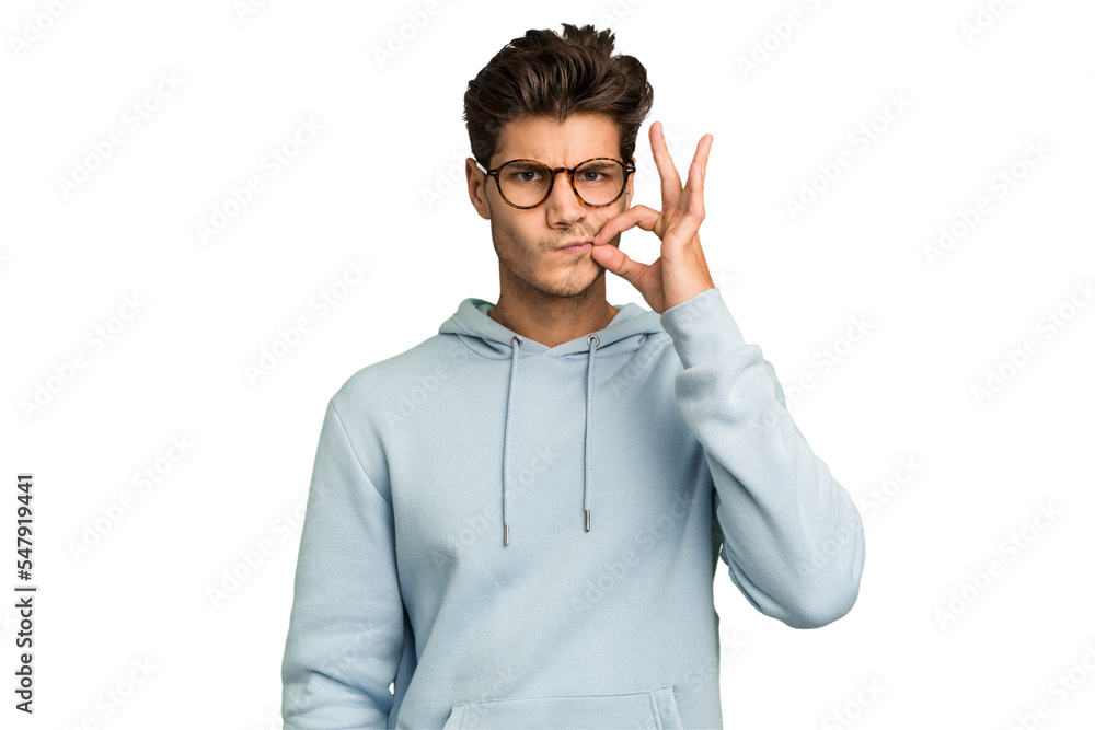 Young caucasian handsome man isolated with fingers on lips keeping a secret. Young caucasian handsome man isolated with fingers on lips keeping a secret.