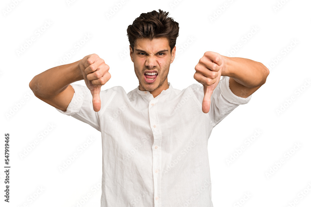 Fototapeta premium Young caucasian handsome man isolated showing thumb down and expressing dislike.