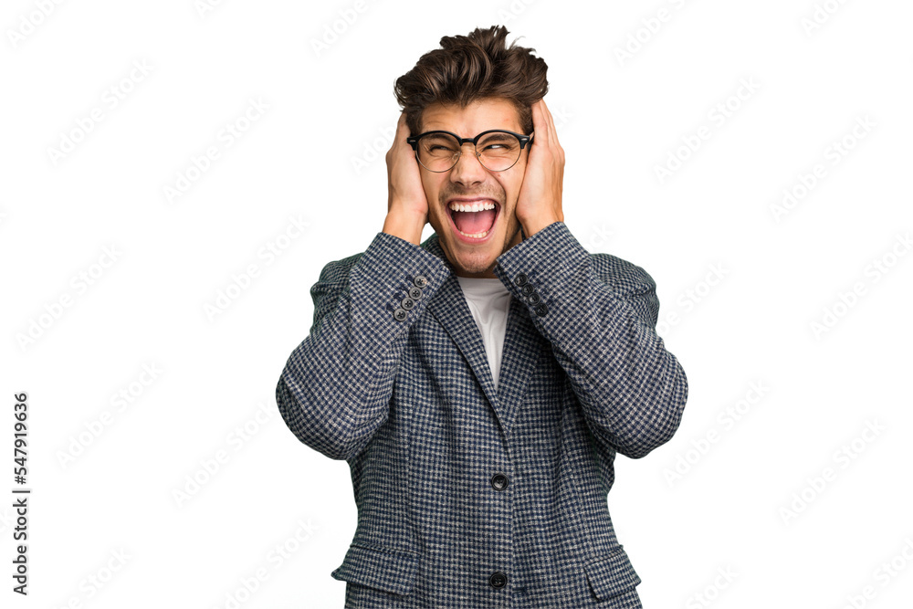Young caucasian handsome man isolated covering ears with hands trying not to hear too loud sound. Young caucasian handsome man isolated covering ears with hands trying not to hear too loud sound.