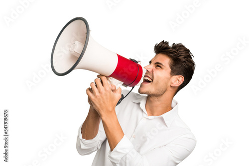 Young caucasian man screaming with a megaphone isolated