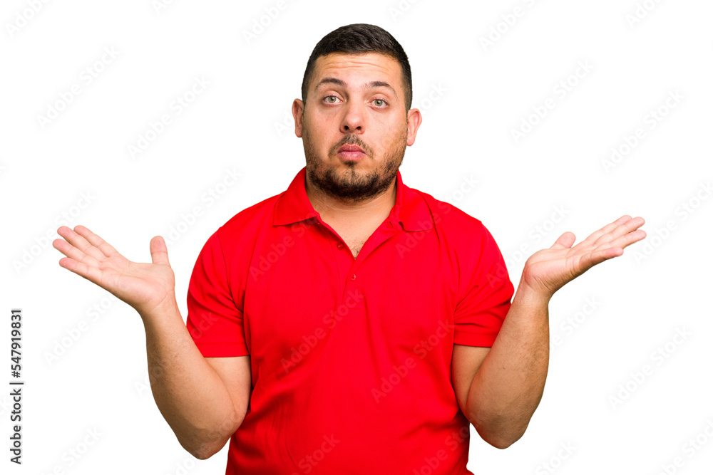 Young caucasian man isolated doubting and shrugging shoulders in questioning gesture. Young caucasian man isolated doubting and shrugging shoulders in questioning gesture.