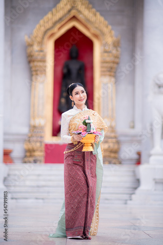 Beautiful girl in White Thai dress © nokkaew