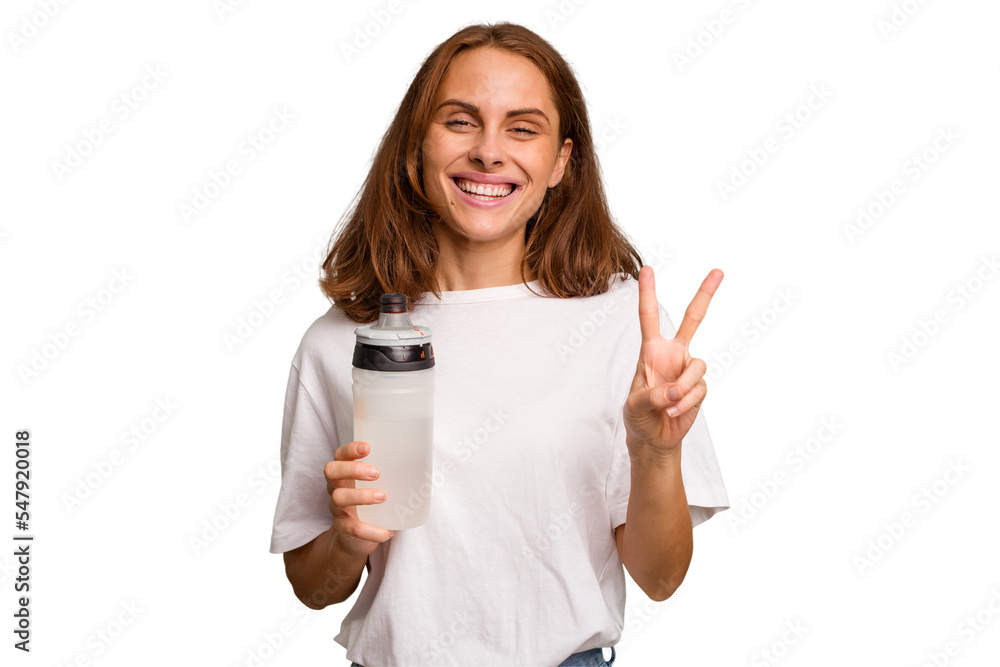 Young caucasian sport woman holding a bottle of water isolated showing number two with fingers. Young caucasian sport woman holding a bottle of water isolated showing number two with fingers.