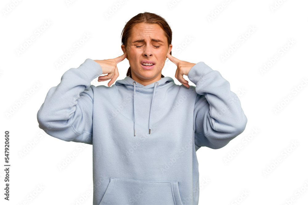Young caucasian woman isolated covering ears with fingers, stressed and desperate by a loudly ambient. Young caucasian woman isolated covering ears with fingers, stressed and desperate by a loudly ambient.