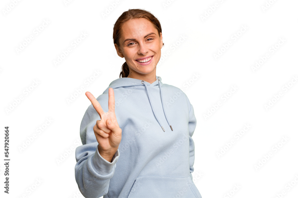 Young caucasian woman isolated showing victory sign and smiling broadly. Young caucasian woman isolated showing victory sign and smiling broadly.