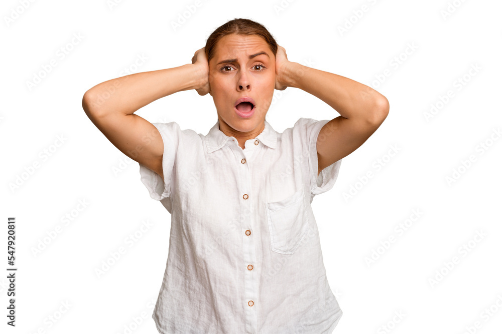 Young caucasian woman isolated covering ears with hands trying not to hear too loud sound. Young caucasian woman isolated covering ears with hands trying not to hear too loud sound.