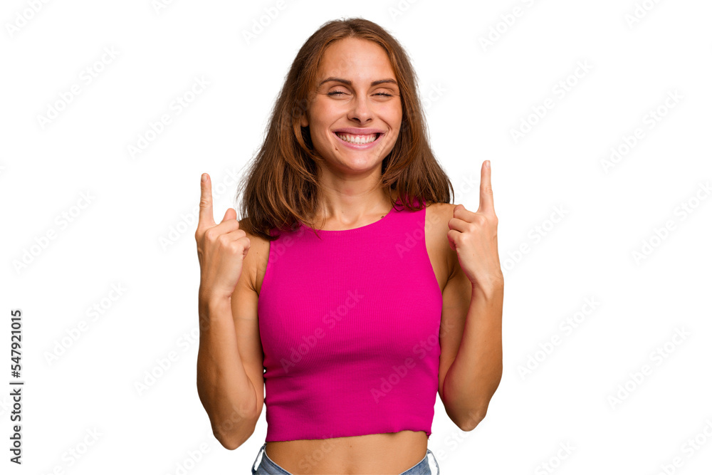 Young caucasian woman isolated indicates with both fore fingers up showing a blank space. Young caucasian woman isolated indicates with both fore fingers up showing a blank space.
