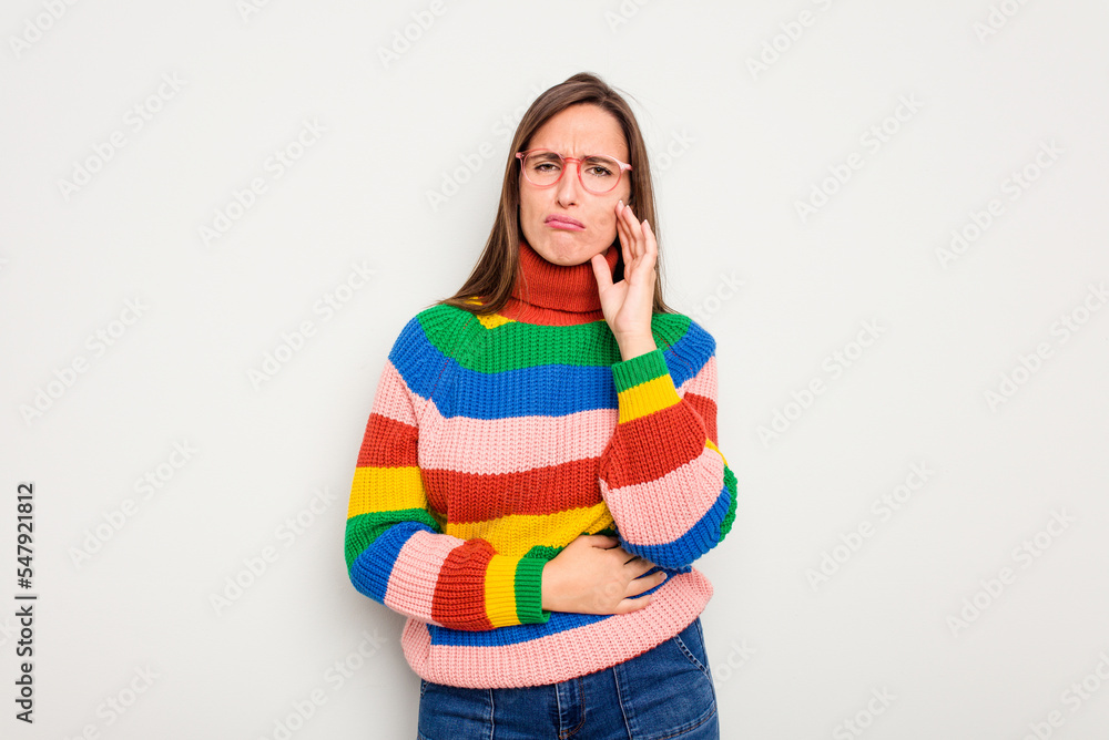 Young caucasian cute woman isolated on white background blows cheeks, has tired expression. Facial expression concept. Young caucasian cute woman isolated on white background blows cheeks, has tired expression. Facial expression concept.