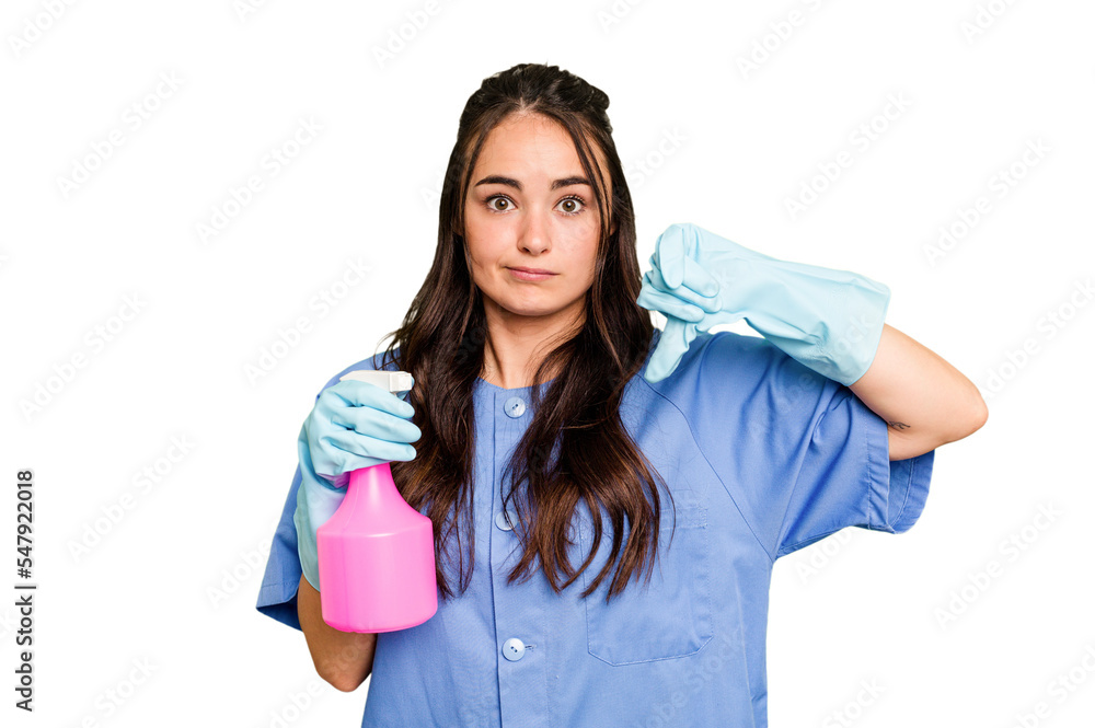 Young cleaner caucasian woman isolated on green chroma background showing a dislike gesture, thumbs down. Disagreement concept. Young cleaner caucasian woman isolated on green chroma background showing a dislike gesture, thumbs down. Disagreement concept.