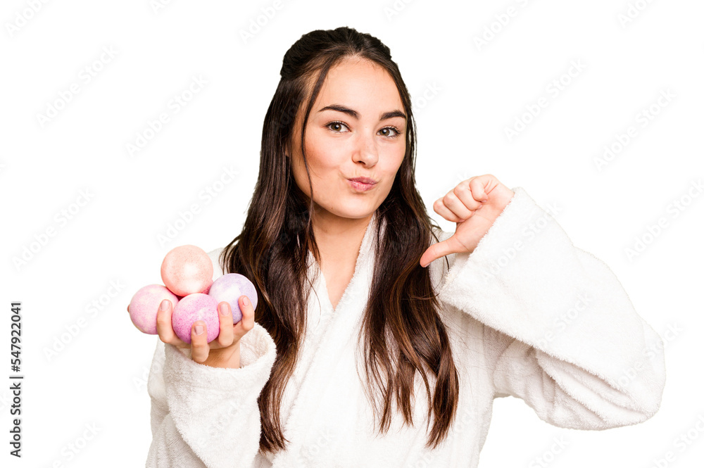 Young caucasian woman holding aromatic balls for bathtub isolated on green chroma background feels proud and self confident, example to follow. Young caucasian woman holding aromatic balls for bathtub isolated on green chroma background feels proud and self confident, example to follow.